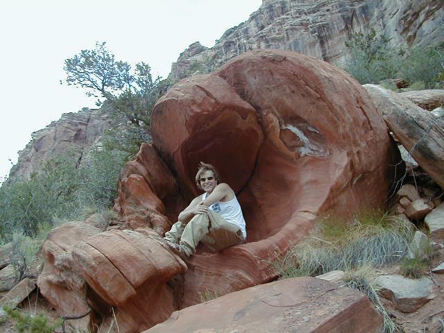 John hanging out in a sandstone cave in Canyon De Chelley.